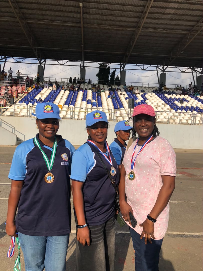 Staff with competition medals